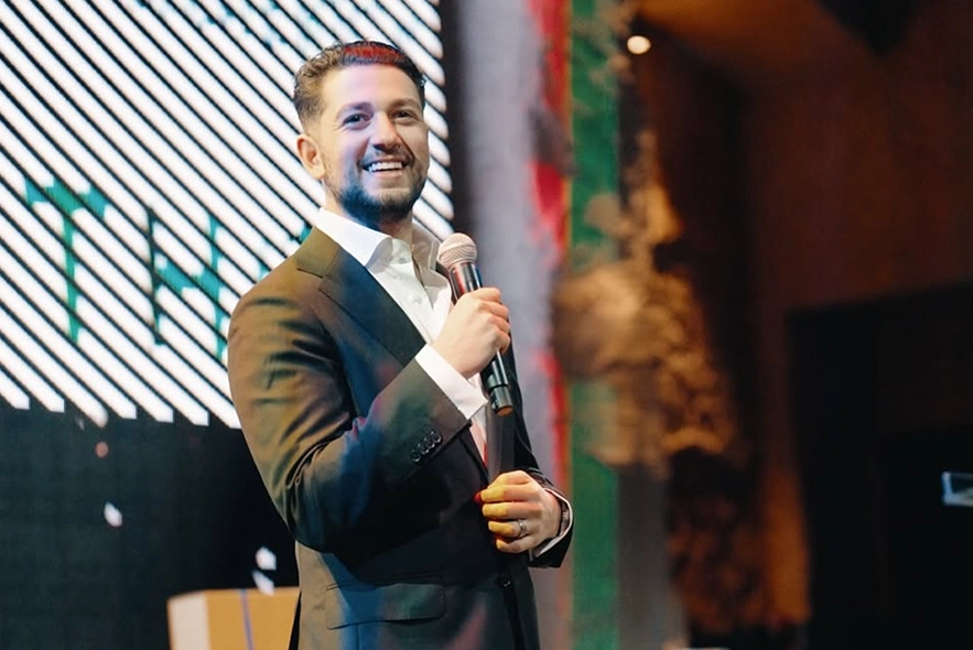 Christian Jamal speaking on stage